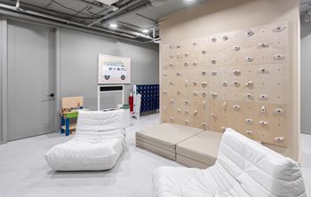Kids play area with climbing wall and foam mats